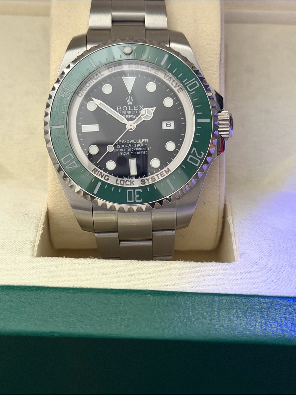 Rolex Sea‑Dweller Stainless Steel Watch with Green Bezel and Black Dial